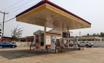 Fuel station canopy and forecourt with pumps